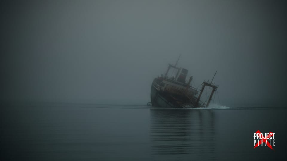 Cargo ship sinking in fog on calm waters